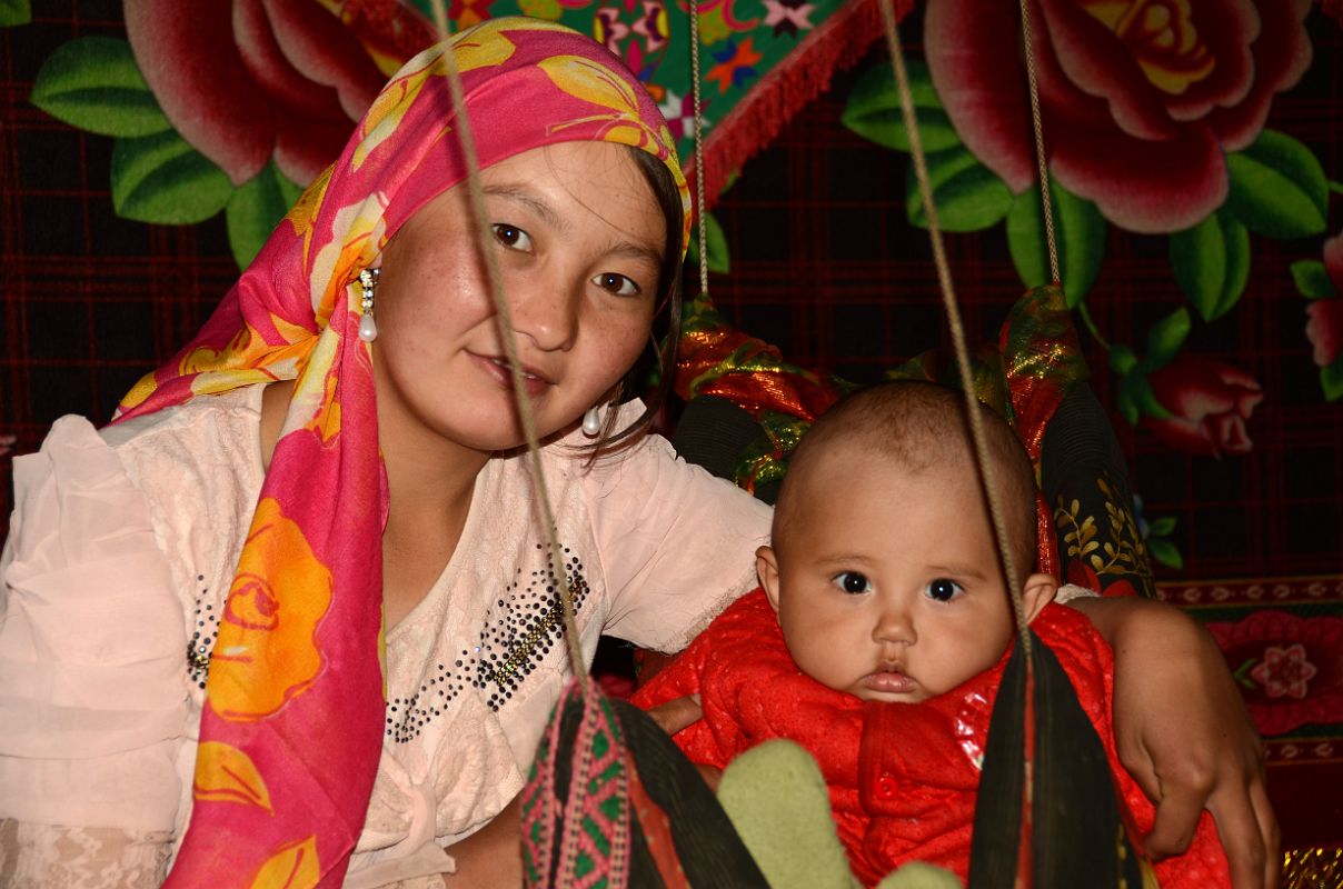 09 Yilik Headman Daughter And Her Child In A Swing In Their Sleeping Area On The Way To K2 China Trek